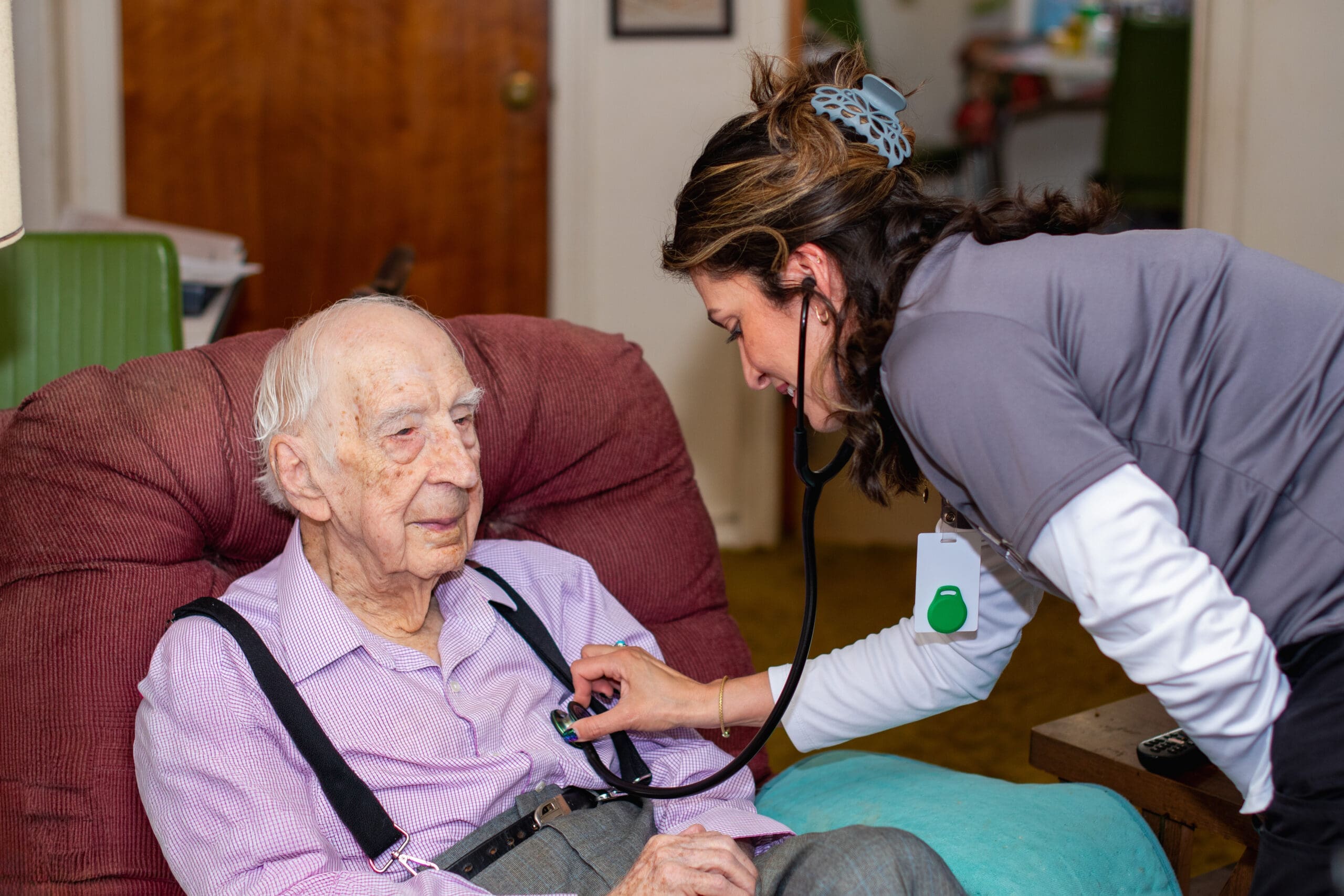 VNA nurse checking a patient's vitals.